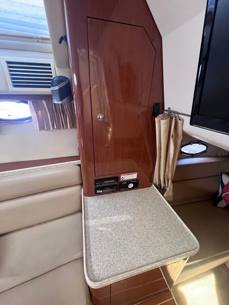 Slide: The Image of Interior of 2007 Regal 3360 Window Express with wooden cabinetry. - 30