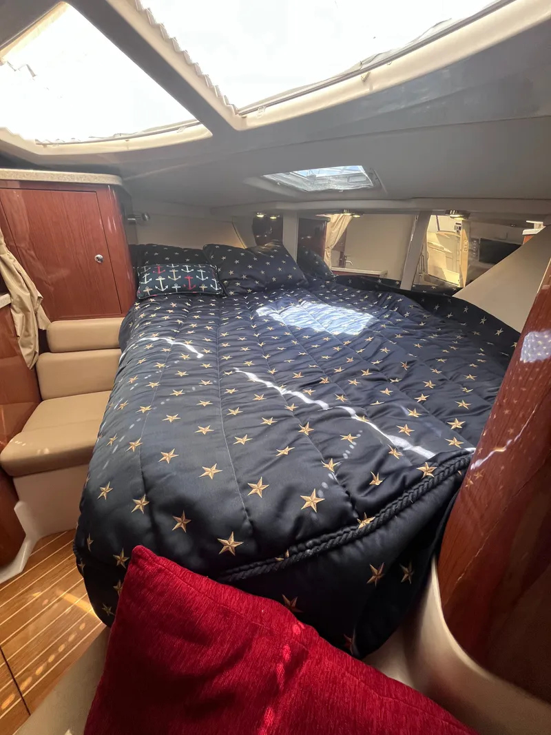 Slide: The Image of Interior of a 2007 Regal 3360 yacht with cozy bed. - 31
