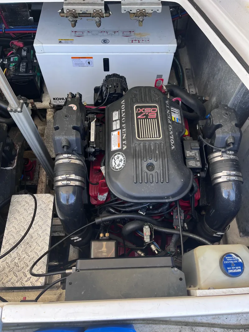 Slide: The Image of Engine compartment of a 2007 Regal 3360 Window Express boat. - 37