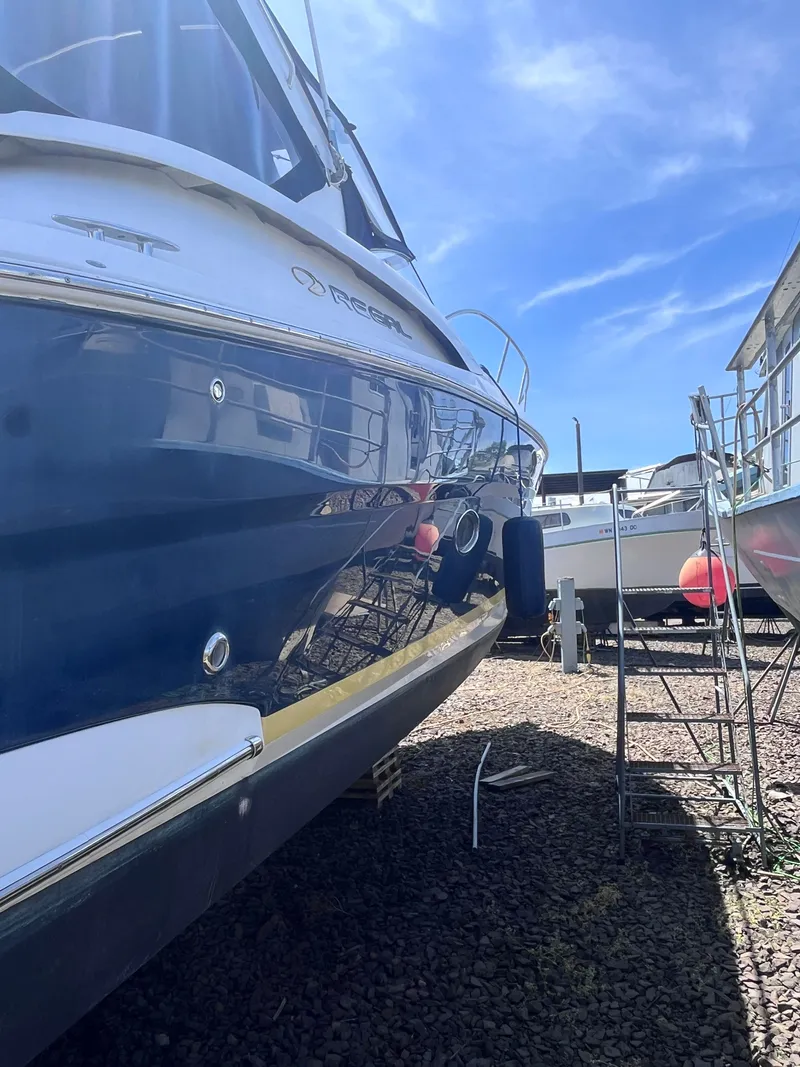 Slide: The Image of 2007 Regal 3360 Window Express boat in dry dock under sunny skies. - 6