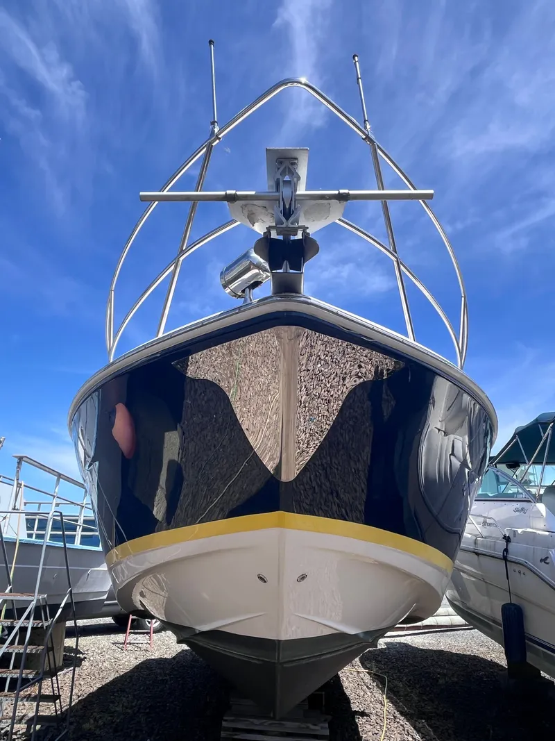 Slide: The Image of 2007 Regal 3360 Window Express boat, front view, blue sky. - 8