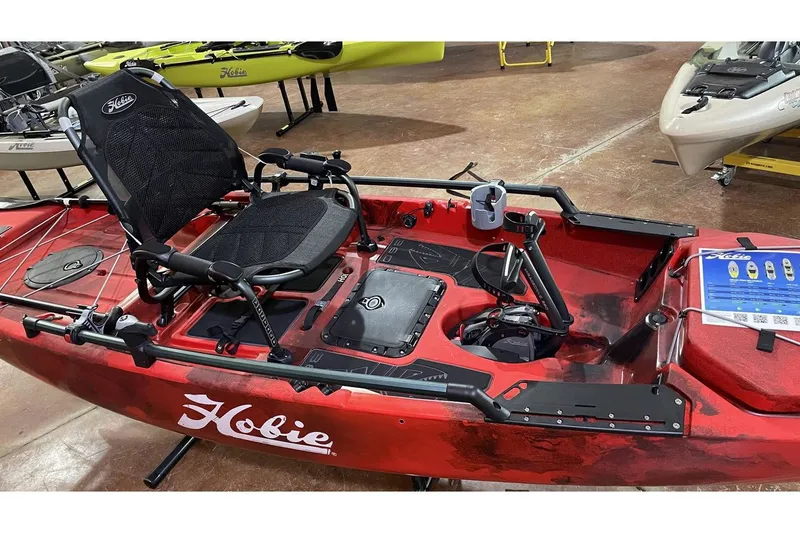 Slide: The Image of 2022 Hobie Pro Angler 14 360 Ike, red fishing kayak in showroom. - 3