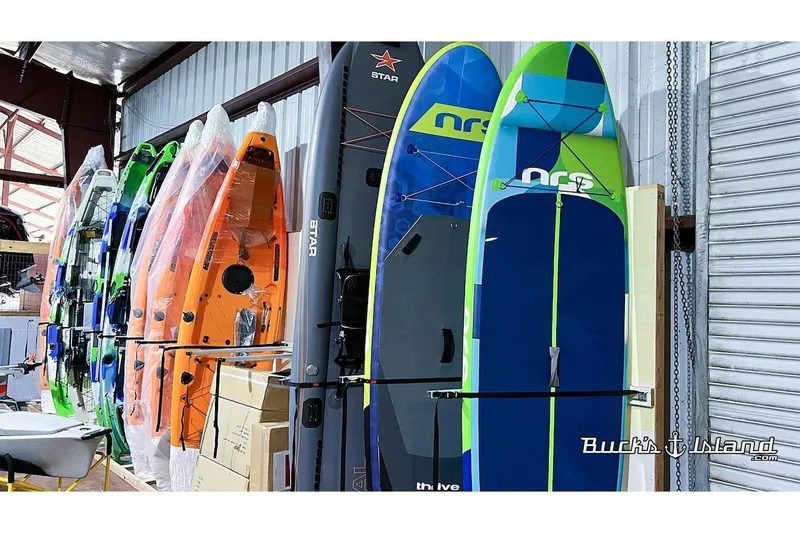 Slide: The Image of Hobie Mirage Pro Angler 14 kayaks and paddleboards in storage. - 3