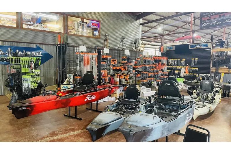 Slide: The Image of Hobie Mirage Itrek 14 Duo 2022 kayaks in an outdoor store. - 10