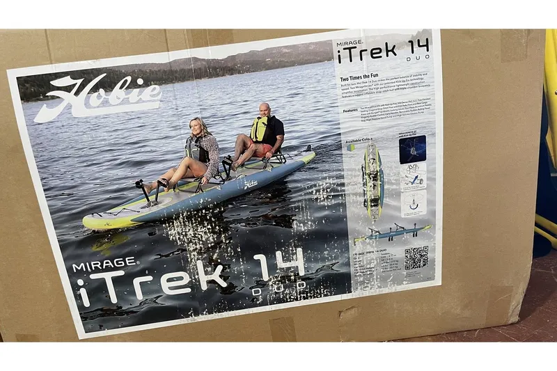 Slide: The Image of Hobie Mirage Itrek 14 Duo 2022 on water with two people. - 3