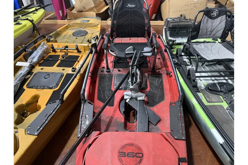 Slide: The Image of Hobie Mirage Pro Angler 14 kayak, red, 2022 model, in warehouse. - 2