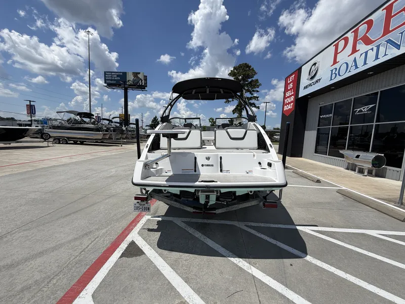 Slide: The Image of 2024 Yamaha AR250 boat parked outside boating store. - 10