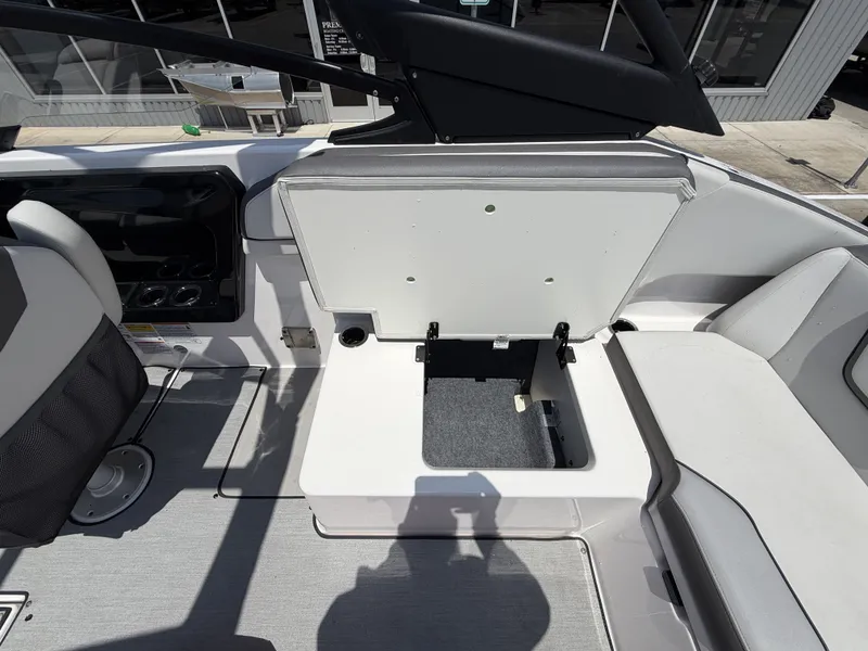 Slide: The Image of Interior of 2024 Yamaha AR250 boat with open storage compartment. - 15