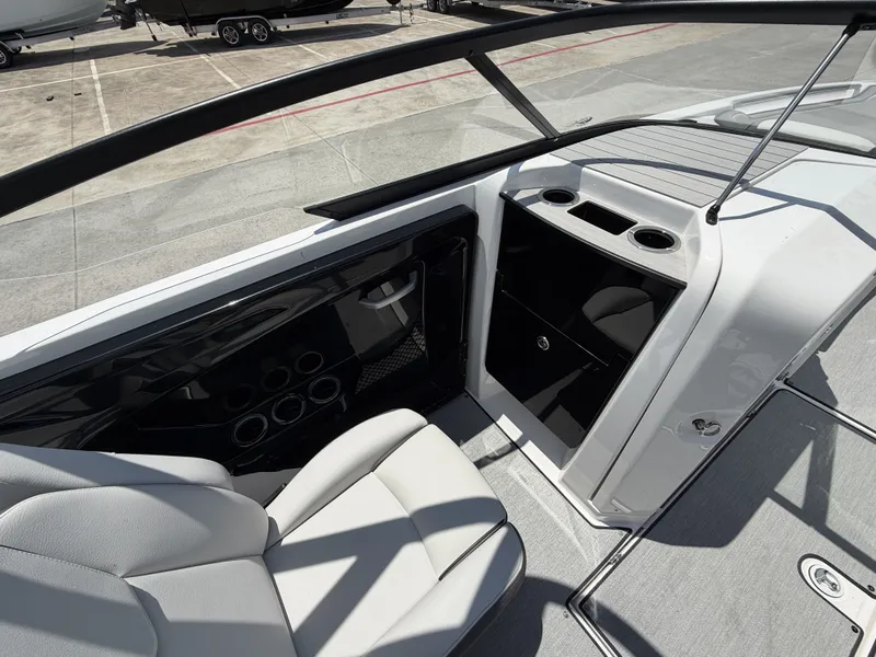 Slide: The Image of Interior of 2024 Yamaha AR250 boat with seating and storage. - 19