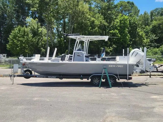 Slide: The Image of 2026 Sea Pro 250 Bay boat parked on trailer outdoors. - 5