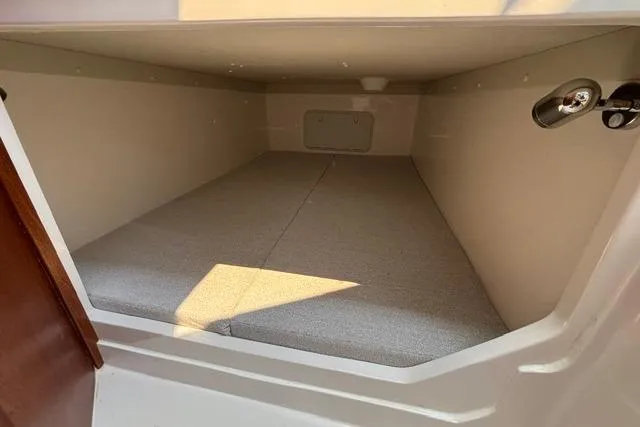 Slide: The Image of Interior cabin of 2026 NorthCoast 285 HT boat, featuring a cozy sleeping area. - 11