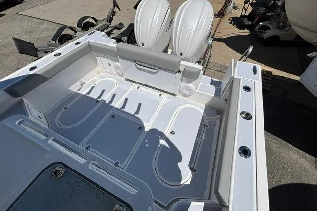 Slide: The Image of NorthCoast 285 HT 2026 boat deck with dual outboard motors, spacious layout. - 4