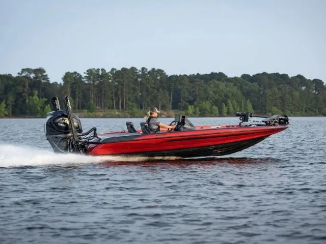 Slide: The Image of 2026 Skeeter FXR20 Apex boat cruising on a lake. - 10