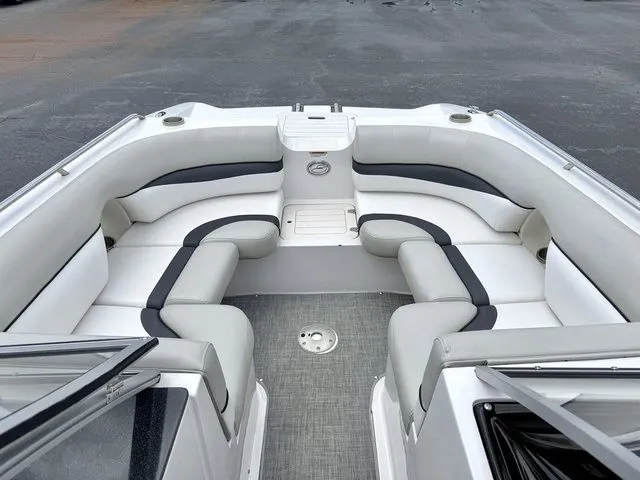 Slide: The Image of Interior of a 2015 Starcraft 210 I/O SCX boat with gray and white seating. - 10