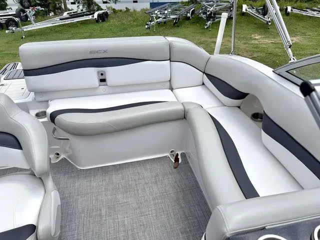 Slide: The Image of Interior of a 2015 Starcraft 210 I/O SCX boat with gray and white seating. - 6