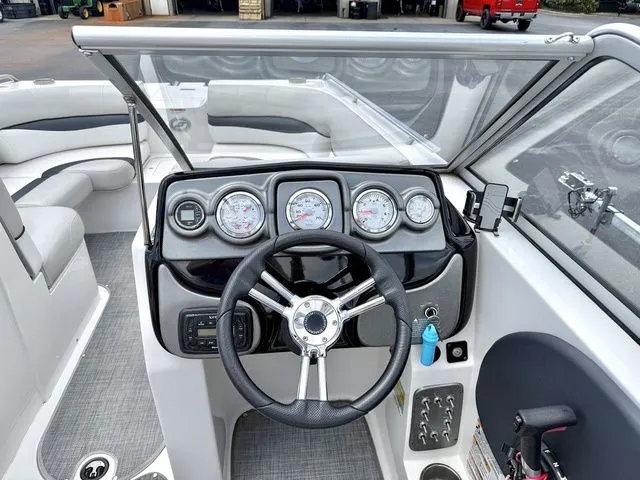 Slide: The Image of Dashboard of a 2015 Starcraft 210 I/O SCX boat with instruments. - 8