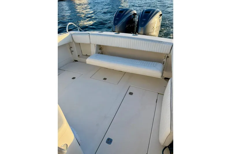 Slide: The Image of 2008 Jupiter 38 FS boat interior with twin V8 engines on water. - 11