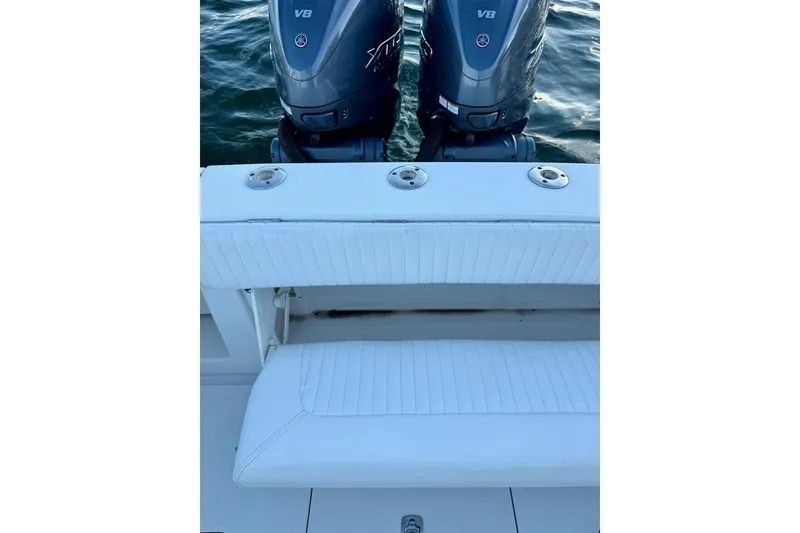 Slide: The Image of 2008 Jupiter 38 FS boat with twin V8 engines and white seating. - 16