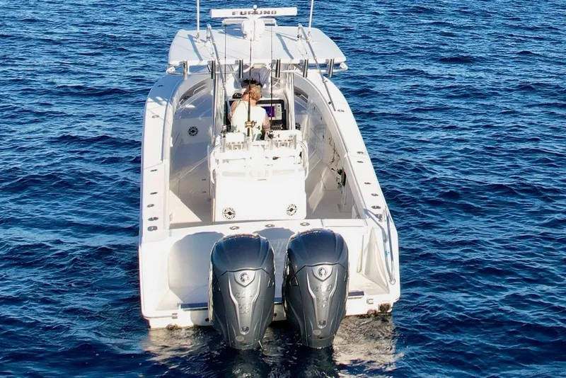Slide: The Image of 2008 Jupiter 38 FS boat with dual engines on open water. - 3