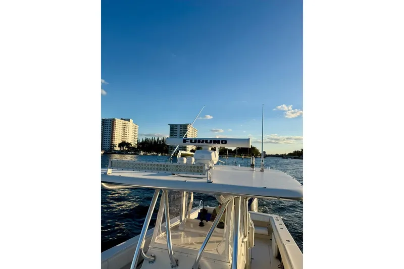 Slide: The Image of 2008 Jupiter 38 FS boat on water with cityscape background. - 5