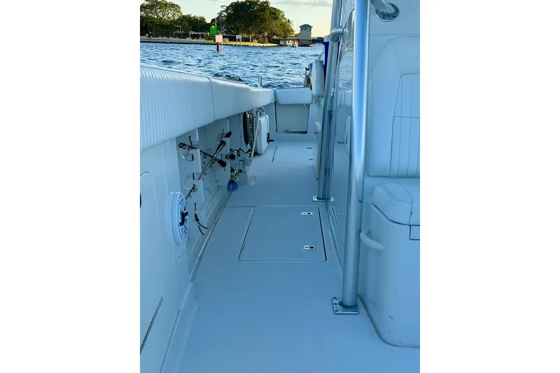 Slide: The Image of 2008 Jupiter 38 FS boat deck with fishing rod holders, near calm waters. - 9