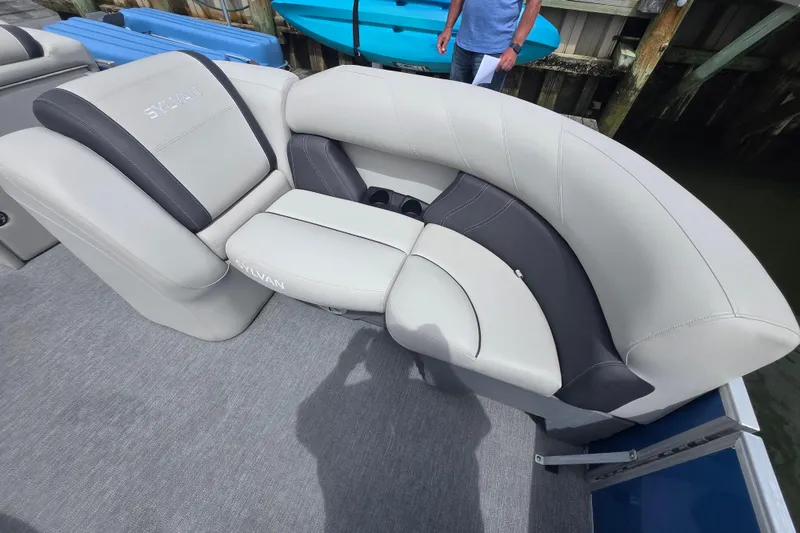 Slide: The Image of 2022 Sylvan 8522 Mirage Cruise boat with luxurious seating and modern design. - 11