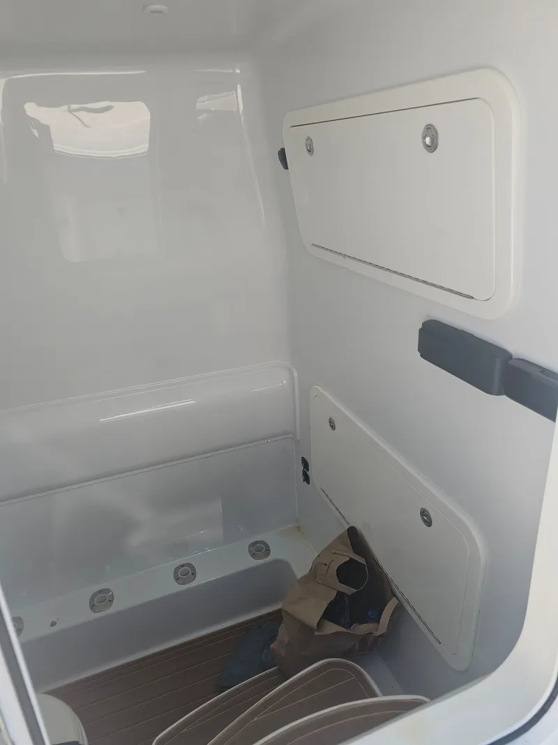 Slide: The Image of Interior of a 2017 Yellowfin 39 Offshore boat with storage compartments. - 11