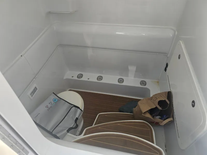 Slide: The Image of Interior of a 2017 Yellowfin 39 Offshore boat with storage area. - 12