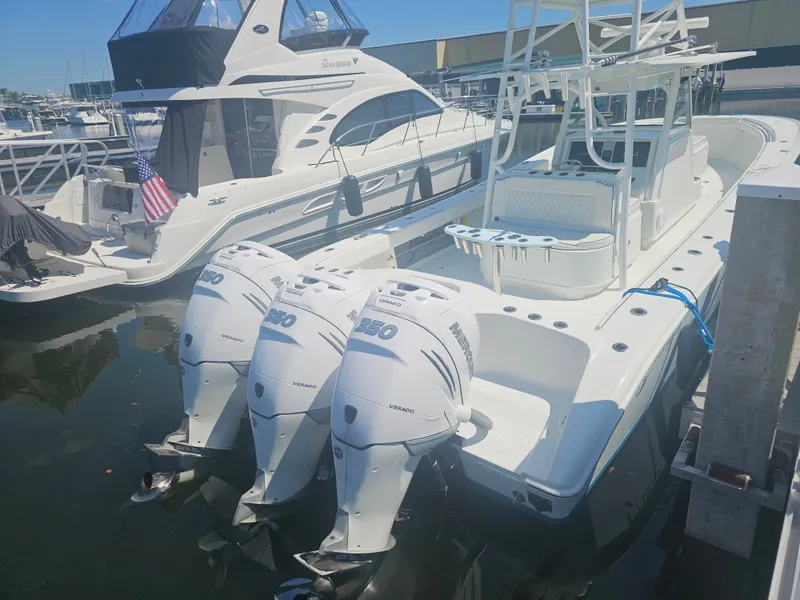 Slide: The Image of 2017 Yellowfin 39 Offshore with triple Mercury engines docked. - 16