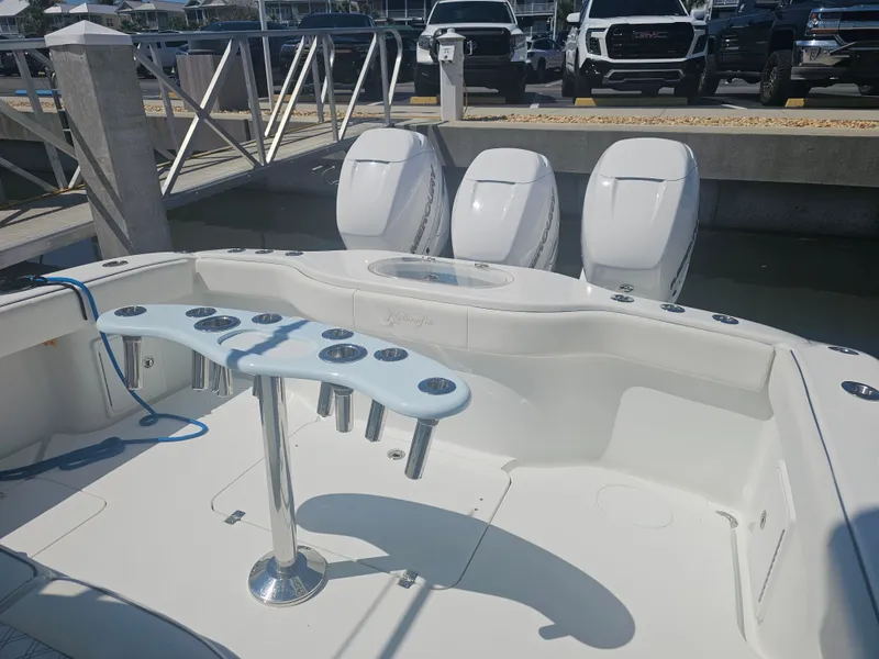 Slide: The Image of 2017 Yellowfin 39 Offshore with triple outboard engines at dock. - 2