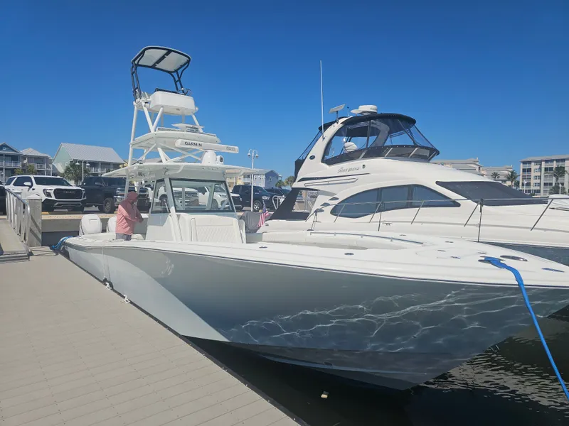 Slide: The Image of 2017 Yellowfin 39 Offshore boat docked under sunny skies. - 5