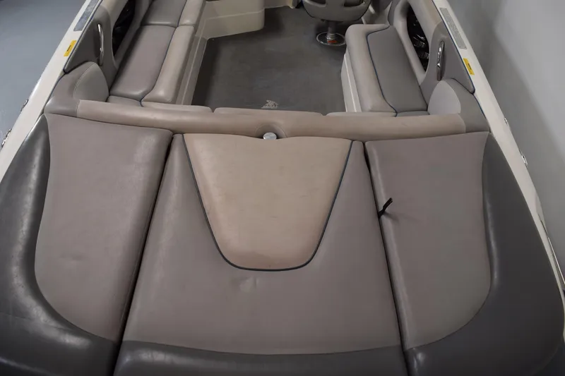 Slide: The Image of 2007 Centurion SV 240 boat interior with gray and beige seating arrangement. - 10