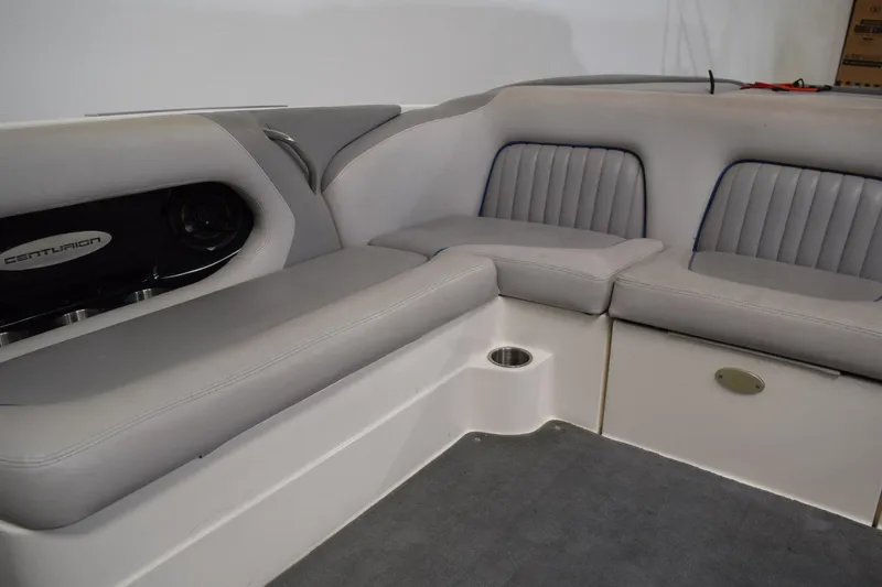 Slide: The Image of 2007 Centurion SV 240 boat interior with gray seating and speaker system. - 13