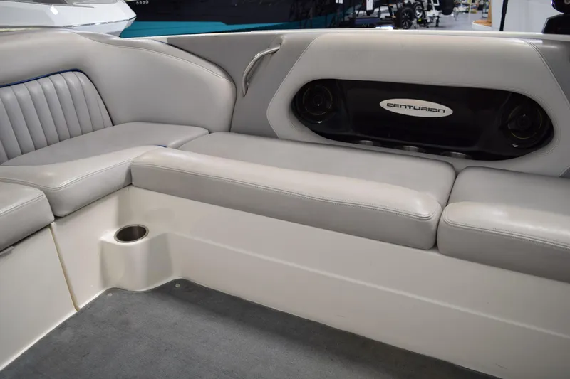 Slide: The Image of Luxurious seating in a 2007 Centurion SV 240 boat with integrated speakers. - 15