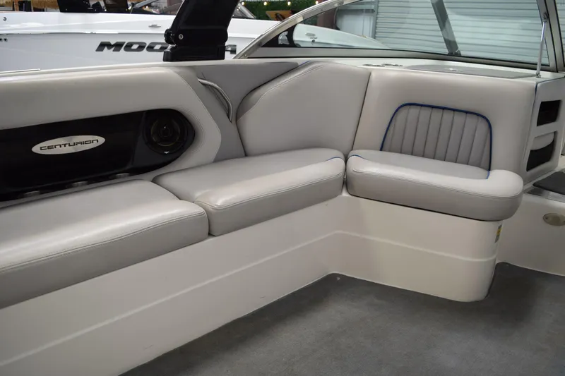 Slide: The Image of Interior of a 2007 Centurion SV 240 boat with gray seating and speaker system. - 16