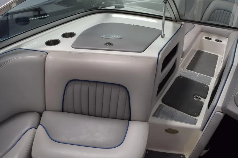Slide: The Image of Interior of a 2007 Centurion SV 240 boat, featuring gray seating and cup holders. - 18