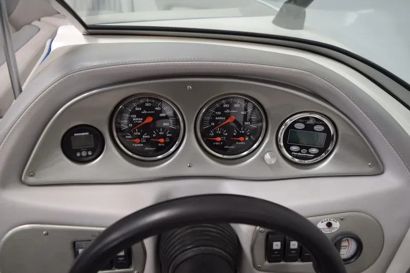 Slide: The Image of Dashboard of a 2007 Centurion SV 240 boat with gauges and controls. - 23