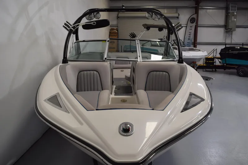 Slide: The Image of 2007 Centurion SV 240 boat in showroom, featuring sleek design and comfortable seating. - 4