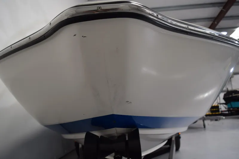 Slide: The Image of 2007 Centurion SV 240 boat hull in indoor storage, close-up view. - 5