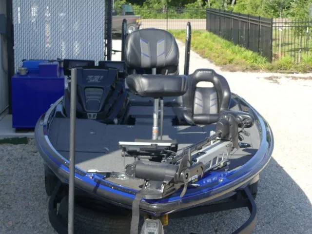 Slide: The Image of 2022 Nitro Z21 Pro boat with modern features on gravel path. - 19