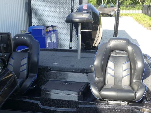Slide: The Image of 2022 Nitro Z21 Pro boat with black seats and motor. - 23