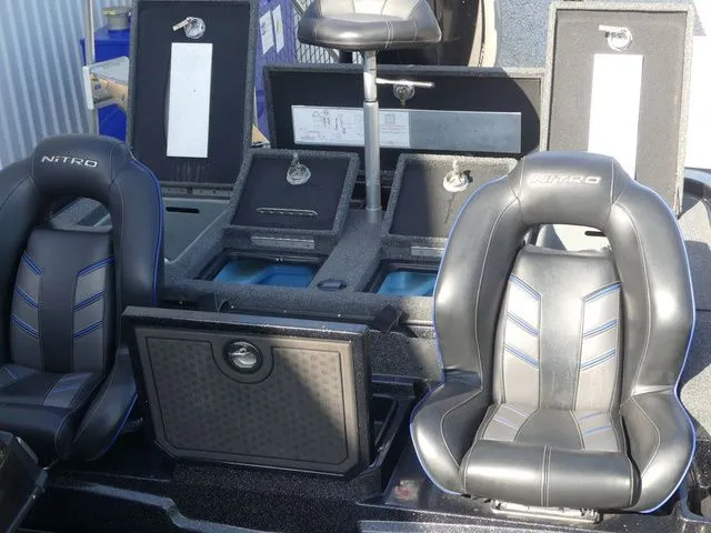 Slide: The Image of Interior of 2022 Nitro Z21 Pro with black seats and storage compartments. - 42