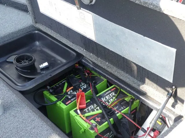 Slide: The Image of Battery compartment of a 2022 Nitro Z21 Pro boat with Tracker batteries. - 48