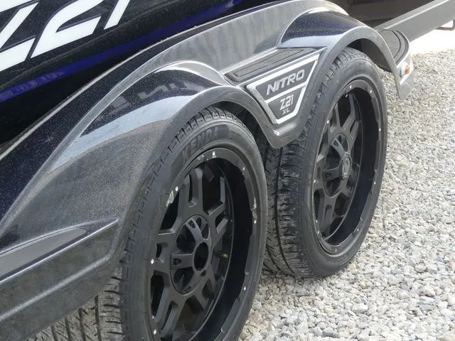 Slide: The Image of Close-up of wheels on a 2022 Nitro Z21 Pro boat trailer. - 8