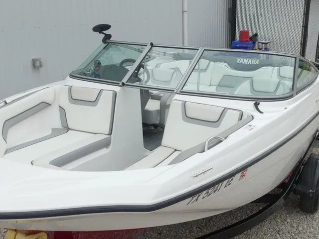 Slide: The Image of 2018 Yamaha SX190 boat with white interior, parked outdoors. - 15