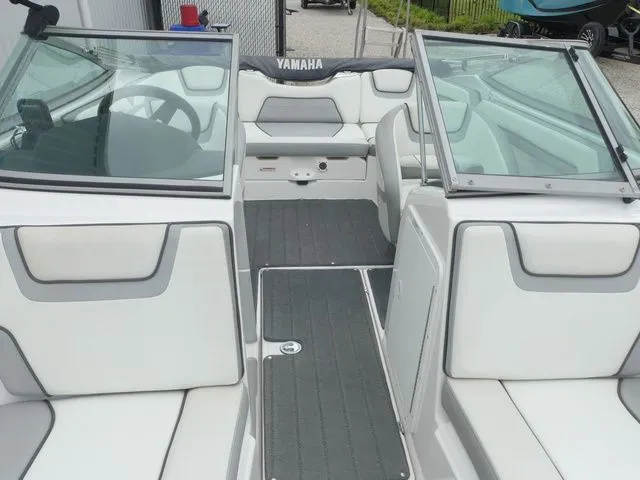 Slide: The Image of Interior of a 2018 Yamaha SX190 boat with gray and white seating. - 17