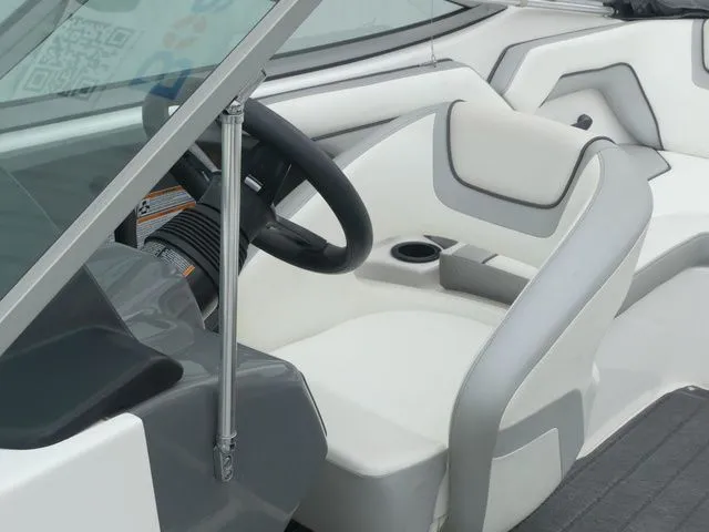 Slide: The Image of Interior of a 2018 Yamaha SX190 boat with steering wheel and seat. - 19