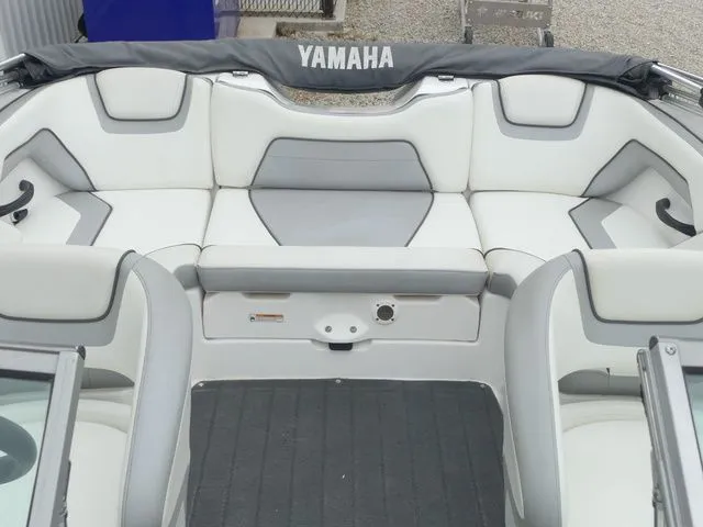Slide: The Image of Interior of a 2018 Yamaha SX190 boat with gray and white seating. - 20