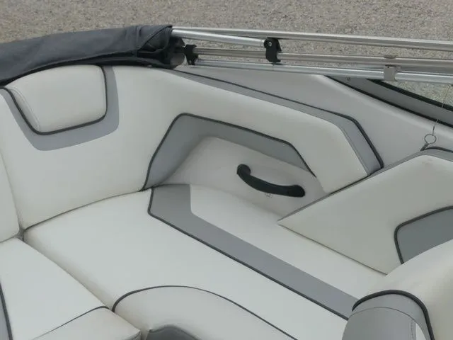 Slide: The Image of Interior of a 2018 Yamaha SX190 boat with gray and white upholstery. - 21