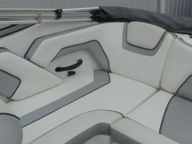 Slide: The Image of Interior of a 2018 Yamaha SX190 boat with gray and white upholstery. - 22